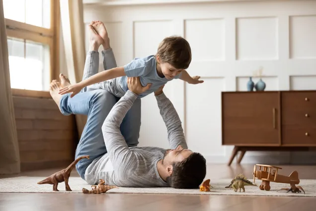 time dad son at play aeroplane dinosaurs 